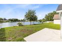 Lush backyard with a serene lake view, perfect for outdoor enjoyment at 139 Andrews Rd, Sanford, FL 32773