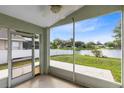 Enjoy relaxing lake views from this screened patio with a ceiling fan at 139 Andrews Rd, Sanford, FL 32773