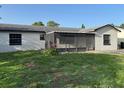 The yard, which includes landscaping, is a beautiful outdoor addition to this home at 2085 San Jose Blvd, Orlando, FL 32808
