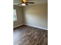 A spacious bedroom offering appealing floor finishes and a ceiling fan for added comfort at 2085 San Jose Blvd, Orlando, FL 32808