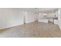 Open-concept living area with tiled flooring, seamlessly connecting the kitchen and dining spaces at 2292 Sirena Ln, Mount Dora, FL 32757