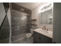 Updated bathroom with a glass-enclosed shower, floating shelves, and a modern vanity at 3149 Quail Dr, Deltona, FL 32738