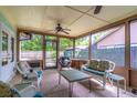 Inviting screened-in porch with ample seating and views of the lush backyard at 638 Boniview Ln, Altamonte Springs, FL 32714
