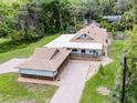 Aerial shot of a cozy home featuring a spacious yard and a covered porch at 740 Florida Blvd, Altamonte Springs, FL 32701