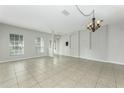 Spacious living room with tile flooring, neutral walls and lots of natural light at 809 Kazaros Cir, Ocoee, FL 34761