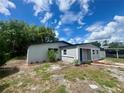 Charming single-story home with fresh exterior paint, landscaping and a welcoming front entrance at 8320 Dominguin St, Orlando, FL 32817