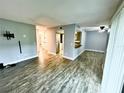 Spacious living room featuring new flooring, neutral paint and lots of light at 9918 Turf Way # 5, Orlando, FL 32837