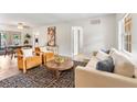 Bright living room featuring modern furniture, wood floors, and stylish decor, with plenty of natural light at 108 Devon Ct, Longwood, FL 32779