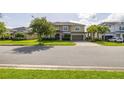 Charming two-story home featuring manicured lawn, a paved driveway, and a two-car garage at 1113 Fieldstone Cir, Oviedo, FL 32765