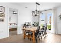 Dining area featuring a wooden table with black chairs and lots of natural light at 1203 Pearl Tree Rd, Deltona, FL 32725
