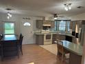 A bright kitchen offers stainless steel appliances, eat-in counter, and a window over the sink at 125 Darlene Ct, Davenport, FL 33897