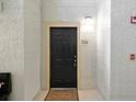 Apartment entrance with a black door and a 'Welcome' mat at 1321 Arbor Vista Loop # 301, Lake Mary, FL 32746