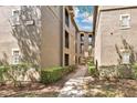 Apartment building exterior featuring walkway access to multiple units at 1321 Arbor Vista Loop # 301, Lake Mary, FL 32746