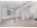 Bright living room with tile floors, neutral paint, and natural light at 17044 Goldcrest Loop, Clermont, FL 34714