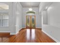 Elegant foyer boasts gleaming hardwood floors, stylish lighting, and a welcoming atmosphere at 19232 Somerset St, Orlando, FL 32833