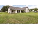 Spacious backyard with a well-maintained lawn, offering ample space for outdoor activities at 2050 Jan Lan Blvd, St Cloud, FL 34772