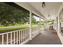 Inviting covered porch with rocking chairs, perfect for enjoying the peaceful neighborhood views at 2050 Jan Lan Blvd, St Cloud, FL 34772