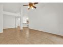 Open living room with tile flooring and a view of the kitchen at 3390 Cypress Point Cir, St Cloud, FL 34772