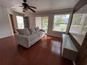 The open living room provides an abundance of light and plenty of space for furniture at 4756 Walden Cir # 21, Orlando, FL 32811