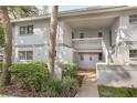 Exterior view of an apartment building with well-maintained landscaping at 563 Midway Trak # K102, Ocala, FL 34472