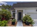 Beautiful home with well-manicured landscaping, inviting entrance, and a charming window feature at 907 Sussex Close # 4, Orlando, FL 32804