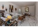 Bright living room featuring stylish furnishings, marble floors, and elegant decor at 907 Sussex Close # 4, Orlando, FL 32804
