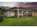 A beautiful screened-in patio extends from this single Gathering home into a large grassy backyard at 1035 Stoney Creek Dr, Lakeland, FL 33811
