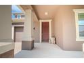 Welcoming covered porch featuring neutral colors and ample space at 13940 Magnolia Ridge Loop, Winter Garden, FL 34787