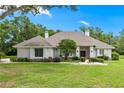 Charming single-story home featuring a well-manicured lawn and inviting front entrance at 1700 Shandwick Ct, Longwood, FL 32779