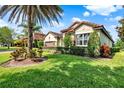 Attractive one-story home featuring lush lawn and mature landscaping at 172 Verde Way, Debary, FL 32713