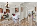Welcoming foyer with decorative lighting, light grey paint, and access to other rooms at 172 Verde Way, Debary, FL 32713