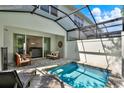 Private screened-in pool area featuring an outdoor shower and lounge seating at 17441 Hidden Forest Dr, Clermont, FL 34714