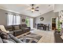 Open-concept living and dining area with gray walls, tile flooring, and modern furnishings at 1785 6Th Ave, Deland, FL 32724