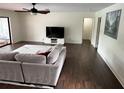 Bright living room with hardwood floors, modern decor, and a large window for natural light at 1809 Pepperidge Dr, Orlando, FL 32806