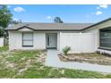 Welcoming entryway featuring a white privacy fence and modern front door, offering a serene entrance at 3187 Shady Willow Dr, Orlando, FL 32808
