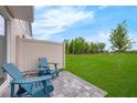 Inviting backyard patio with comfortable seating, ideal for enjoying the outdoors at 3348 Thicket St, Tavares, FL 32778