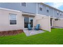 Private outdoor patio with a pair of Adirondack chairs, perfect for relaxation at 3348 Thicket St, Tavares, FL 32778