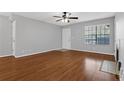 Bright living room featuring wood floors, a ceiling fan, and a fireplace at 351 Lone Hill Dr # 206, Altamonte Springs, FL 32701