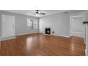 Living room showcasing wood floors, fireplace, ceiling fan, and neutral walls at 351 Lone Hill Dr # 206, Altamonte Springs, FL 32701