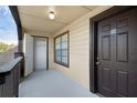 Cozy outdoor patio with door, closet, window, and wooden railing at 351 Lone Hill Dr # 206, Altamonte Springs, FL 32701