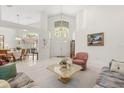 Open-concept living room featuring lots of natural light, high ceilings and tile flooring at 4026 S Lake Orlando Pkwy, Orlando, FL 32808