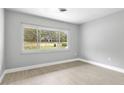 Bright room featuring updated floors, neutral paint, and a large window at 4116 Sw 20Th St, Ocala, FL 34474