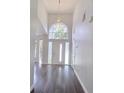 Bright foyer showcasing high ceilings, sleek flooring, and a modern light fixture at 651 Oak Hollow Way, Altamonte Springs, FL 32714