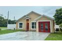 Inviting single-story home featuring a modern exterior and attached garage at 1001 Golfside Ct, Kissimmee, FL 34741