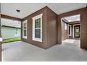 A covered patio with ample space, perfect for outdoor seating and relaxing in the shade at 1375 Brayford Point, Deland, FL 32724