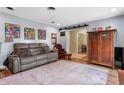 Well-decorated living room featuring a sliding barn door and warm, inviting decor at 1921 Geronimo Trl, Maitland, FL 32751