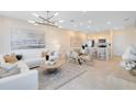Bright living room with neutral tones, contemporary furnishings, and an open concept design at 2349 Southbury Dr, Kissimmee, FL 34744