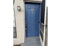 Inviting blue front door with a screen door, a unit number, and outdoor lighting at 2776 Curry Ford Rd # Ge, Orlando, FL 32806