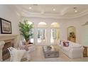 Bright and airy living room with high ceilings and three french doors at 3429 Regal Crest Dr, Longwood, FL 32779