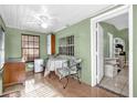 Sun room with tiled floors, ceiling fan, table, and chairs with a leafy design at 4133 Cepeda St, Orlando, FL 32811